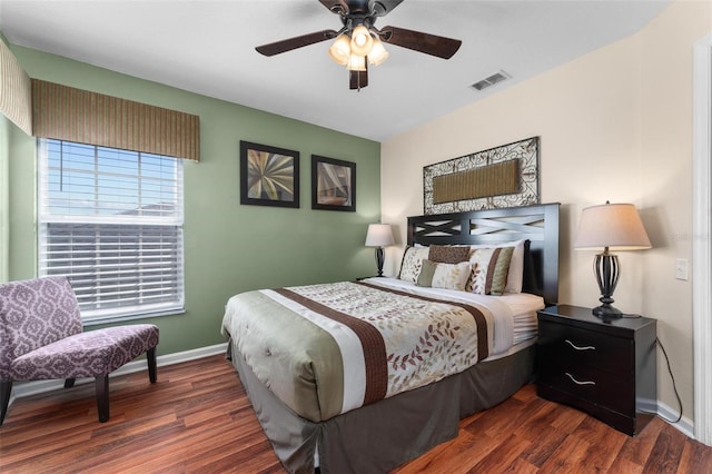 bedroom featuring dark hardwood / wood-style flooring and ceiling fan