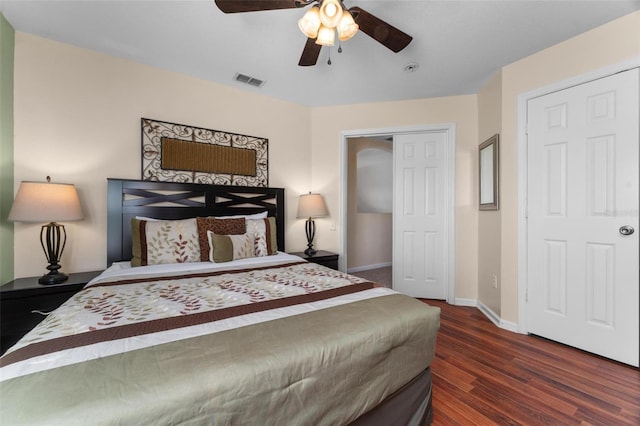 bedroom with a closet, ceiling fan, and dark hardwood / wood-style floors