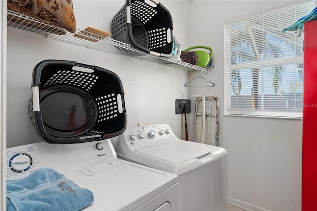 washroom with washing machine and clothes dryer