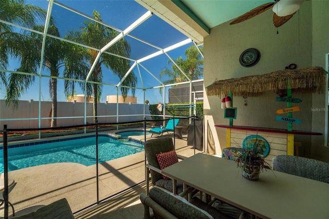 view of pool featuring a lanai, ceiling fan, and a patio area