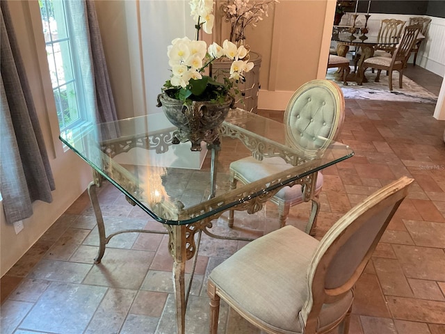 dining space with tile floors