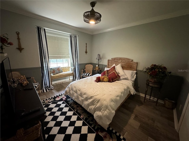 bedroom with dark wood-type flooring and ornamental molding