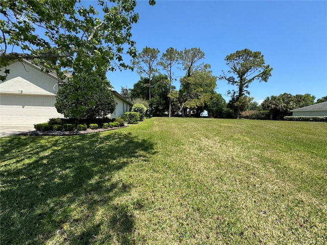 view of yard featuring a garage