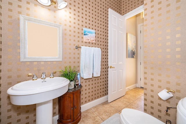 bathroom featuring tile flooring and toilet