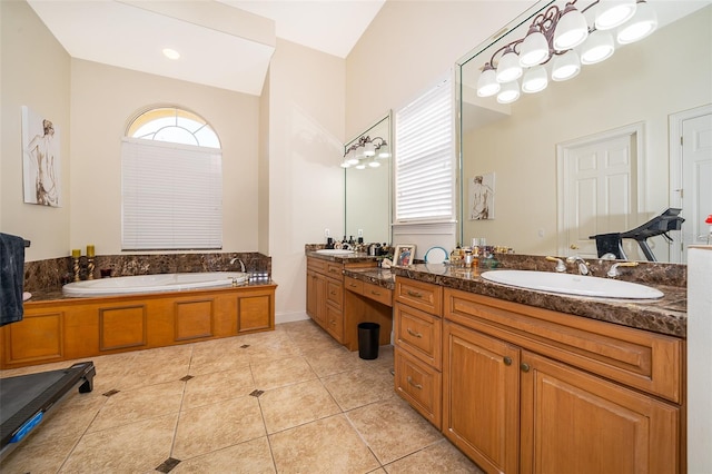 bathroom with double sink vanity, vaulted ceiling, a bathing tub, and tile flooring