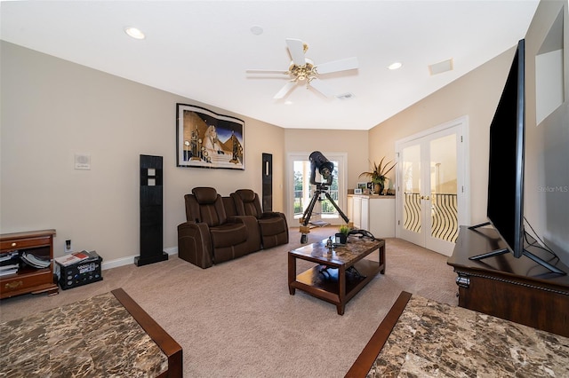 living room featuring light colored carpet and ceiling fan