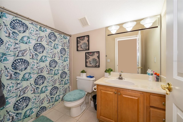 bathroom with vanity with extensive cabinet space, tile floors, and toilet