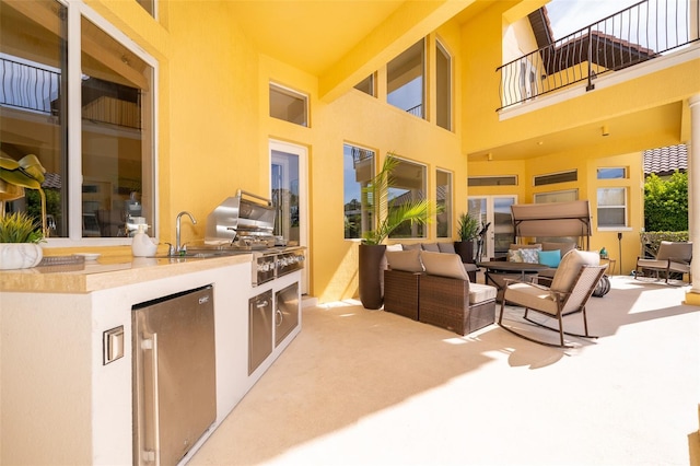 view of patio / terrace featuring a balcony and outdoor lounge area