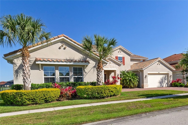 mediterranean / spanish-style house featuring a garage