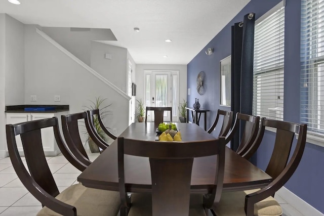 dining space with light tile flooring