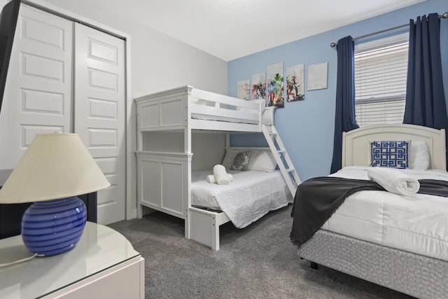 carpeted bedroom featuring a closet