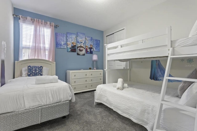 carpeted bedroom featuring a closet