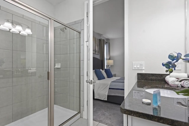 bathroom featuring walk in shower and vanity