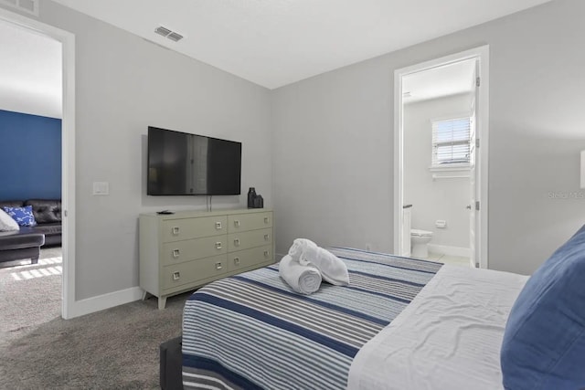 carpeted bedroom with ensuite bathroom