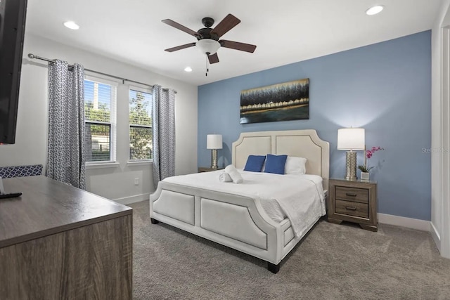 bedroom with ceiling fan and dark colored carpet