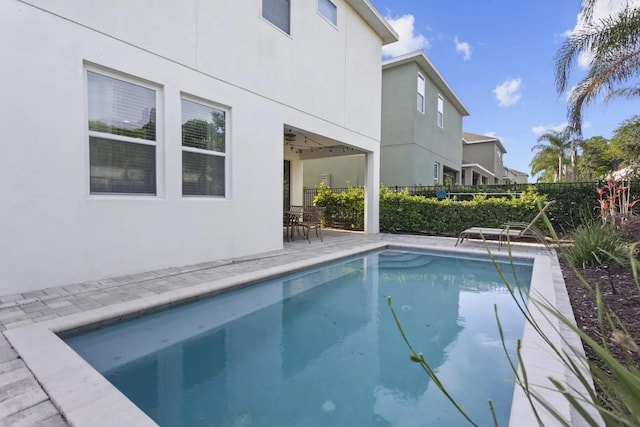 view of swimming pool featuring a patio area