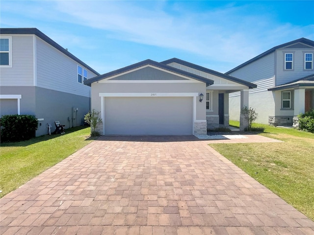 view of front of home with a garage and a front yard