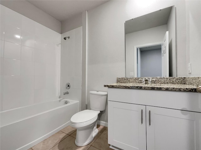 full bathroom with toilet, tile flooring, vanity, and washtub / shower combination