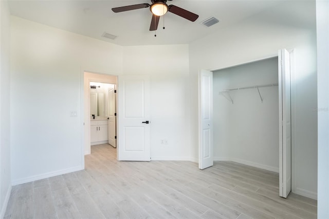 unfurnished bedroom with ceiling fan, light hardwood / wood-style floors, and a closet