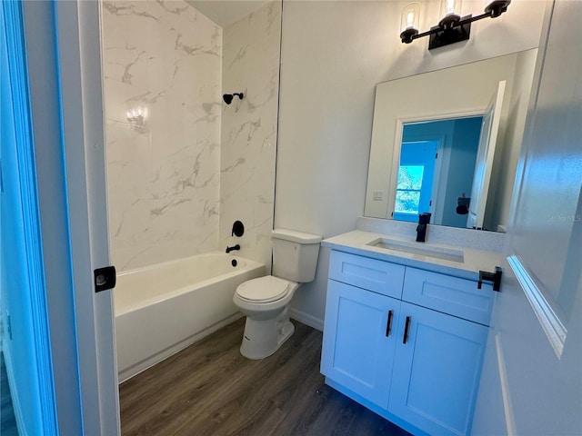 full bathroom with wood-type flooring, vanity, toilet, and tiled shower / bath