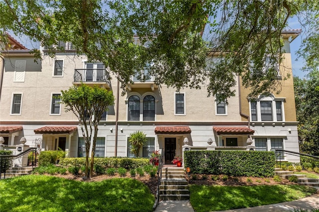 view of front of home with a balcony