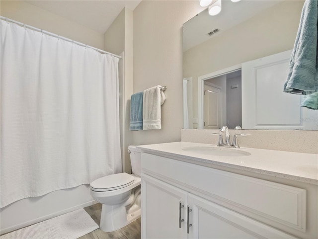 full bathroom with vanity, toilet, shower / tub combo with curtain, and wood-type flooring