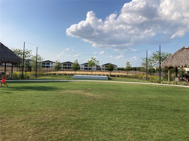 view of property's community with a yard