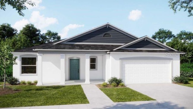 view of front of home with a garage and a front lawn