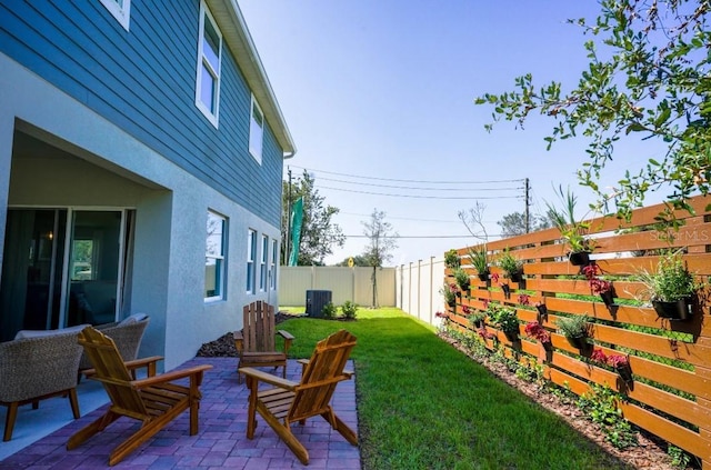 view of yard featuring central AC