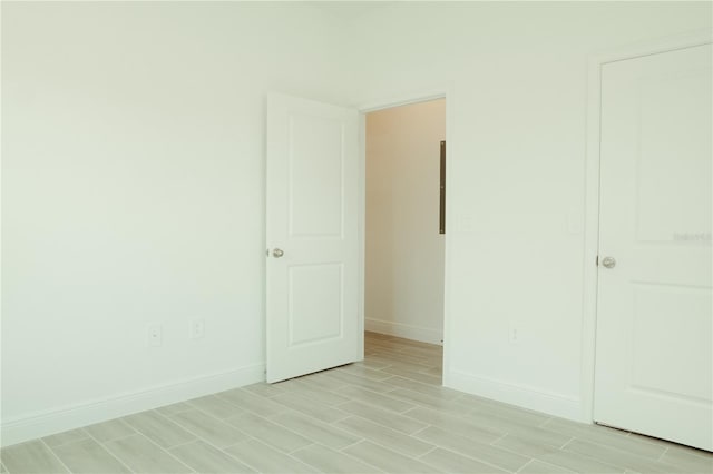 unfurnished bedroom with light wood-type flooring