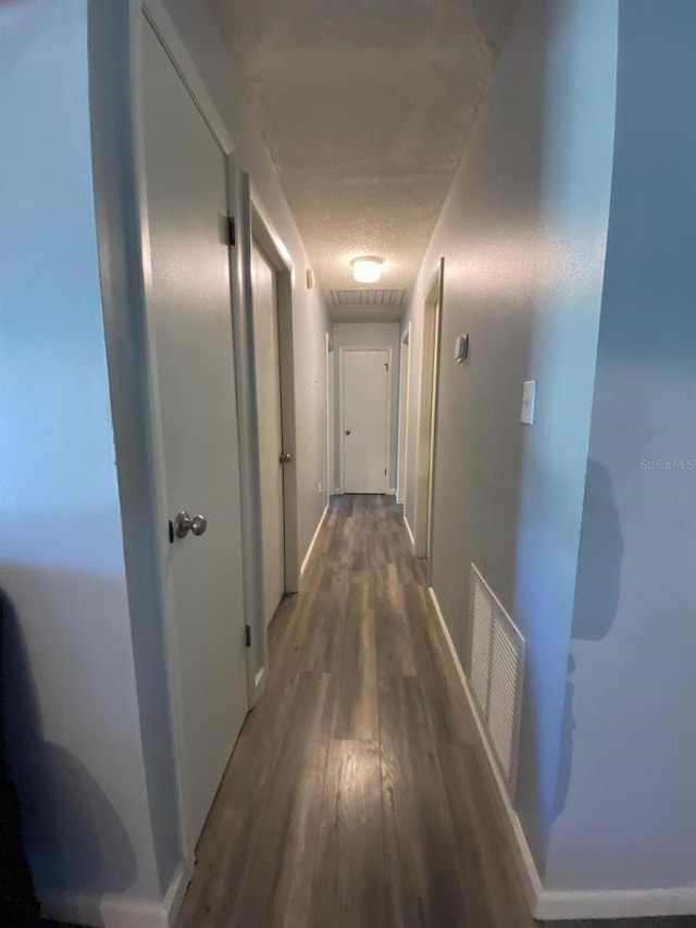 hall with dark hardwood / wood-style flooring