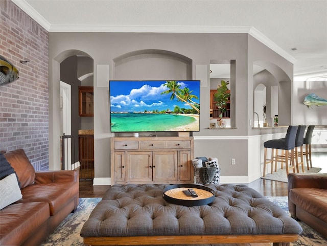 living room featuring dark hardwood / wood-style flooring and crown molding