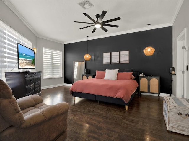 bedroom featuring ceiling fan, crown molding, and dark hardwood / wood-style floors