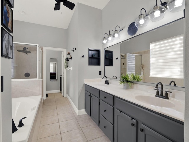 bathroom featuring vanity, a wealth of natural light, tile patterned flooring, and ceiling fan