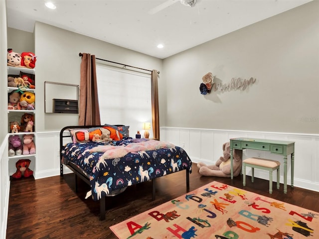 bedroom with ceiling fan and dark wood-type flooring