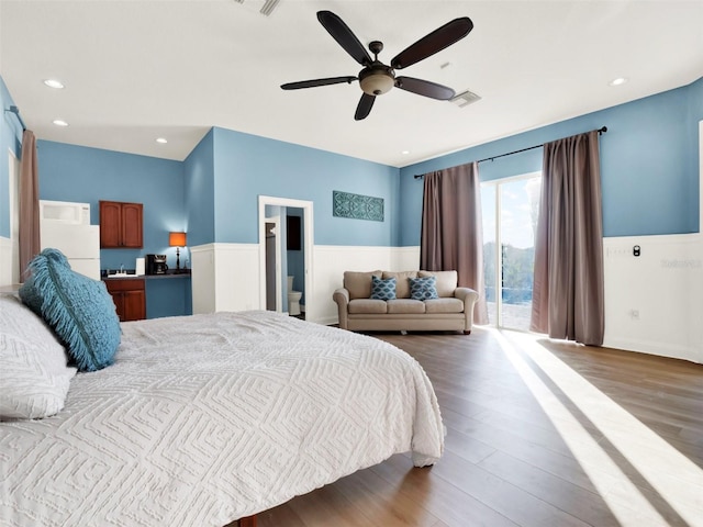 bedroom featuring access to exterior, ceiling fan, and dark wood-type flooring