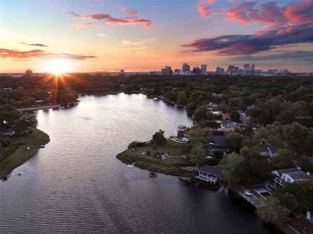 aerial view at dusk with a water view