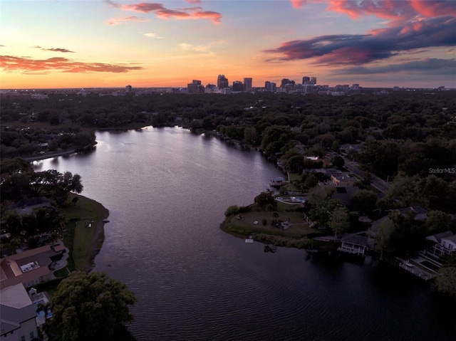 aerial view at dusk with a water view