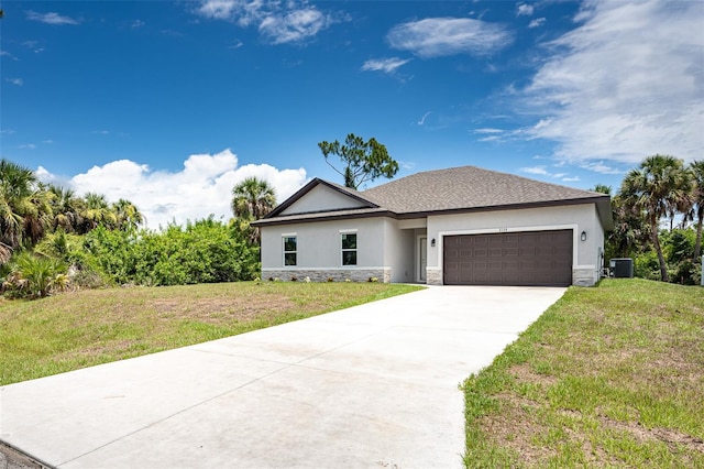 view of front of home with a garage and a front yard