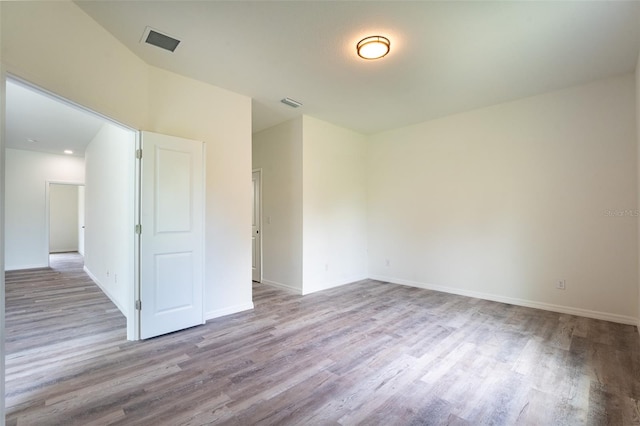 unfurnished room featuring wood-type flooring