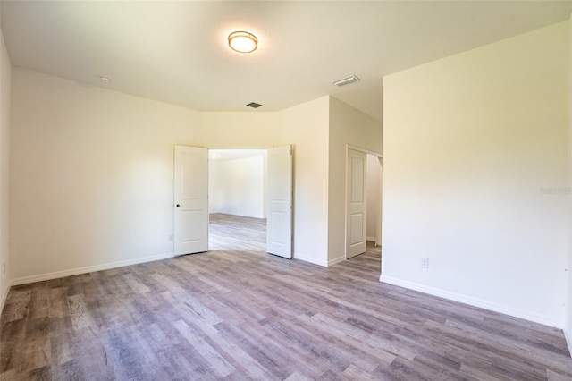 unfurnished bedroom featuring wood-type flooring