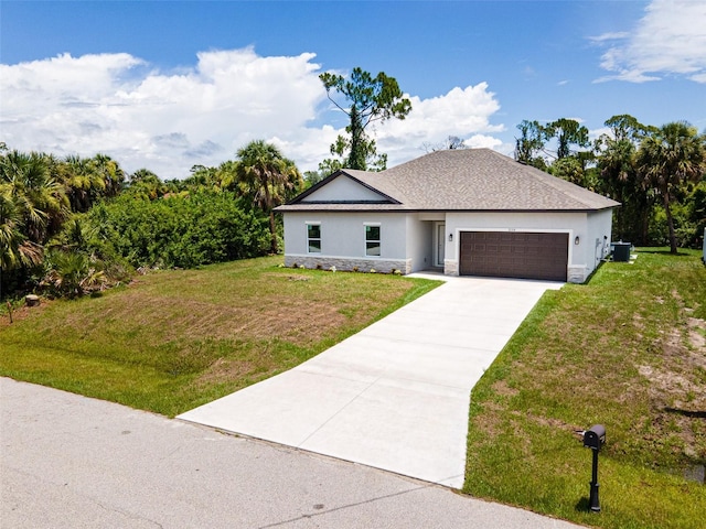 view of front of home featuring a garage and a front yard