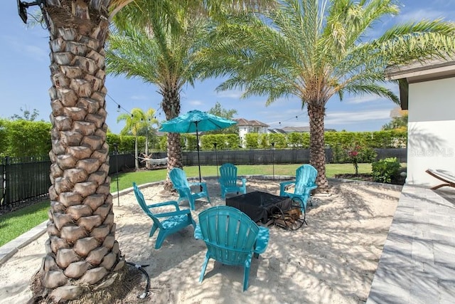 view of patio / terrace with a fire pit