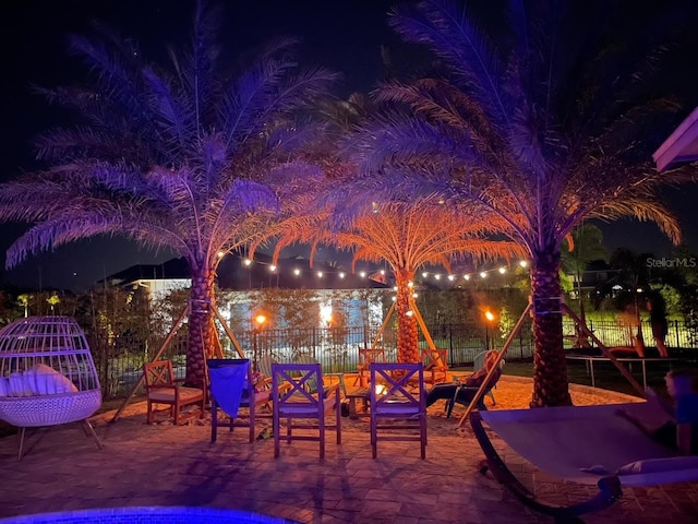 view of patio terrace at twilight