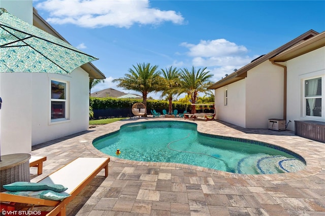 view of swimming pool featuring a patio