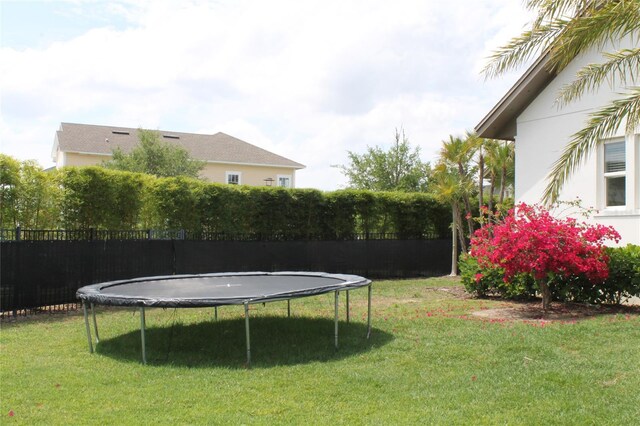 view of yard featuring a trampoline