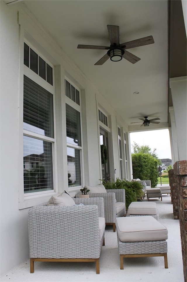 view of patio featuring ceiling fan, outdoor lounge area, and covered porch