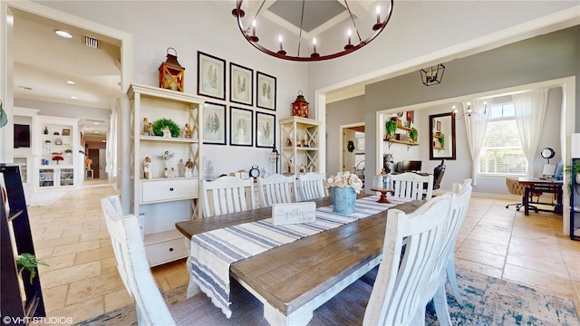 dining area featuring light tile flooring and an inviting chandelier