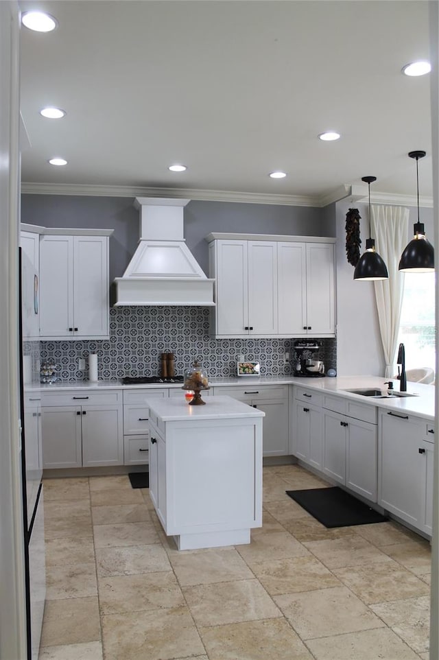 kitchen with backsplash, sink, custom exhaust hood, and light tile floors