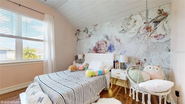 bedroom featuring dark hardwood / wood-style flooring and vaulted ceiling